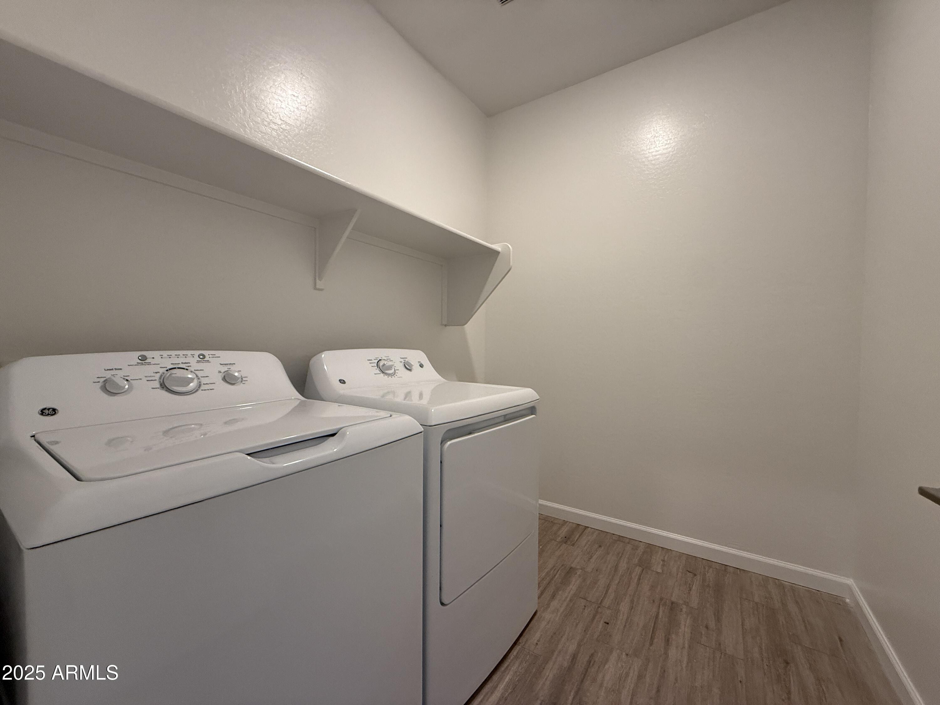 9628 West Tamarisk Avenue Tolleson, AZ 85353 - Photo 11 of 37 a utility room with dryer and washer
