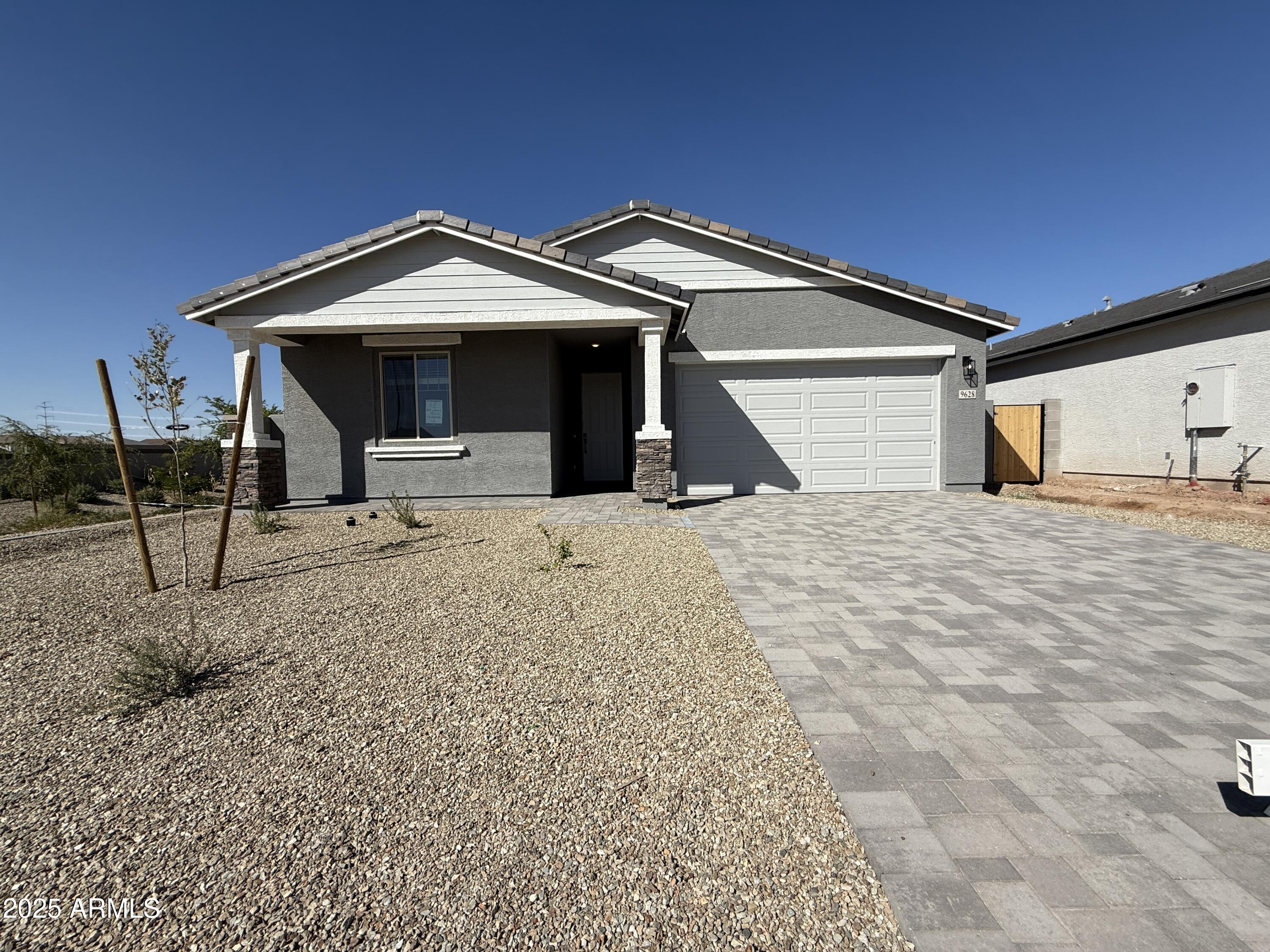 9628 West Tamarisk Avenue Tolleson, AZ 85353 - Photo 2 of 37 a view of a house with large trees