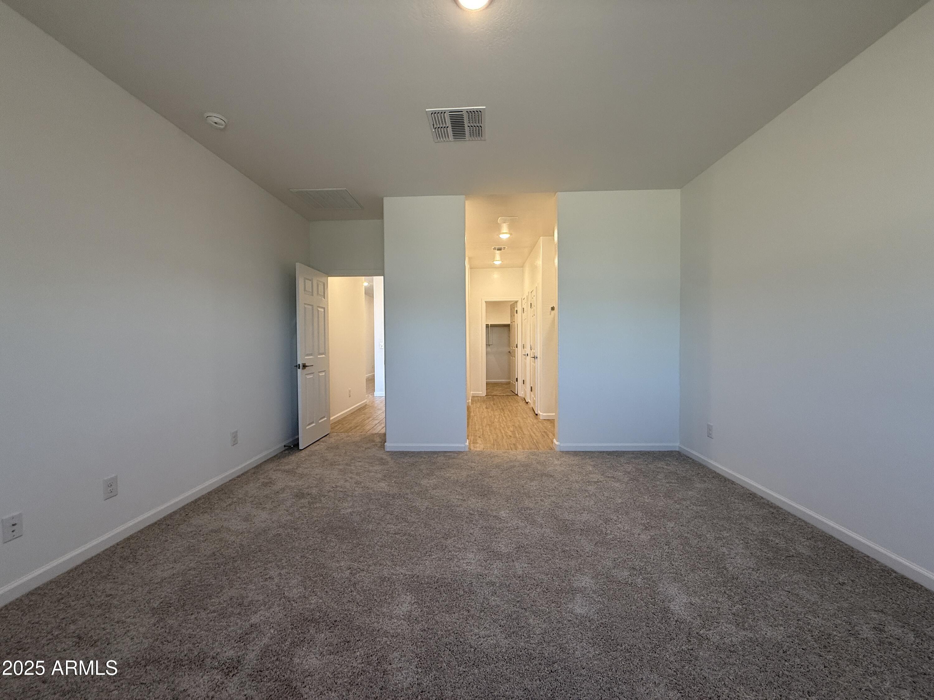 9628 West Tamarisk Avenue Tolleson, AZ 85353 - Photo 26 of 37 a view of an empty room and window