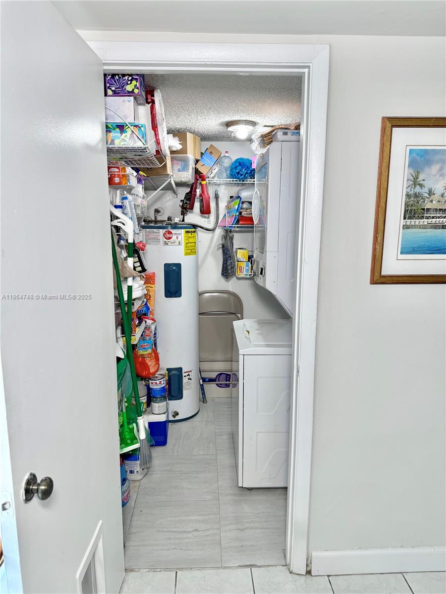 11028 Southwest 132nd Place, Unit 244 Miami, FL 33186 - Photo 12 of 25 a room with storage and utility