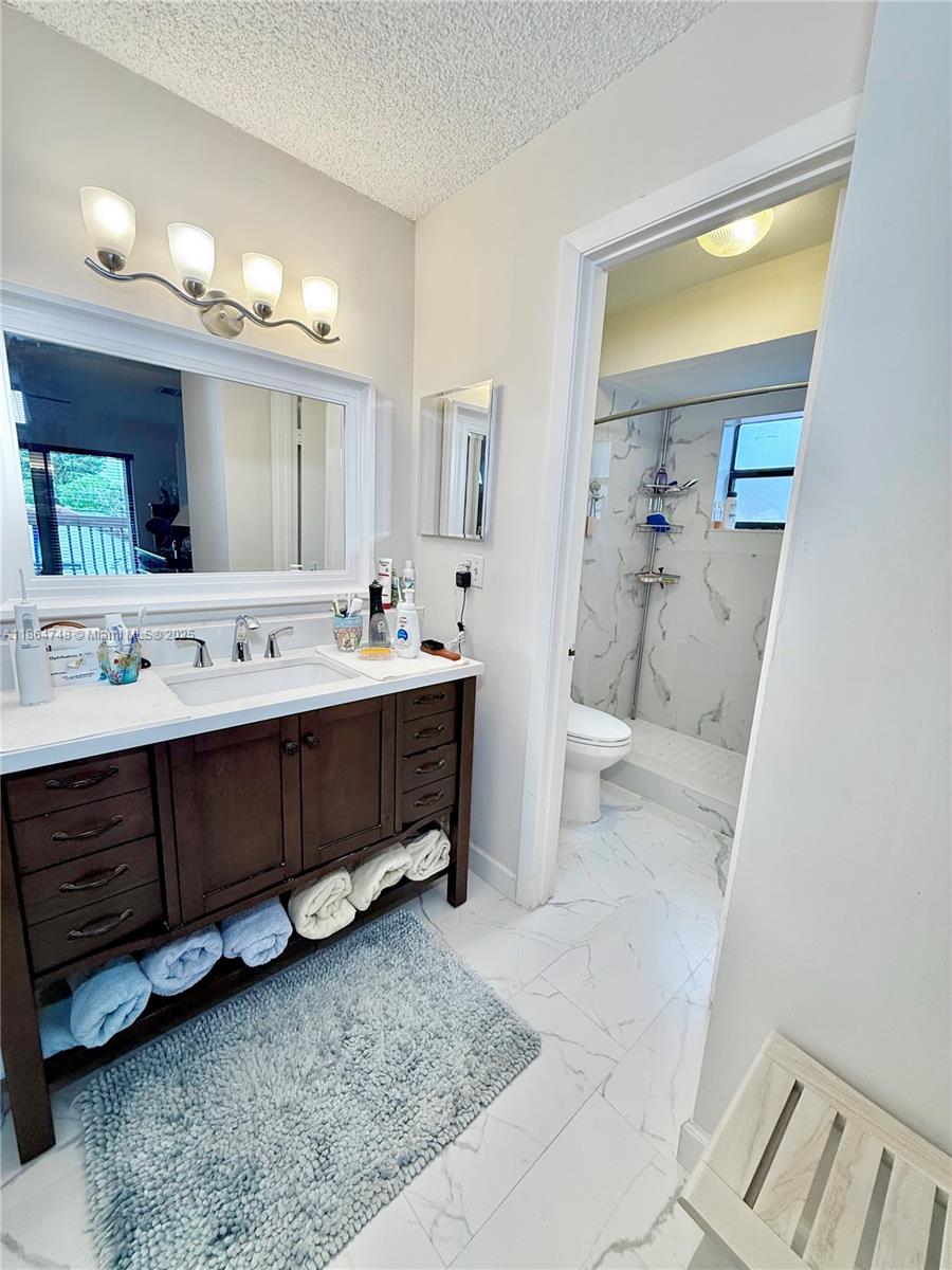 11028 Southwest 132nd Place, Unit 244 Miami, FL 33186 - Photo 19 of 25 a utility room with a washer and dryer