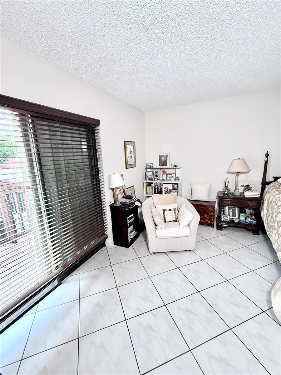 11028 Southwest 132nd Place, Unit 244 Miami, FL 33186 - Photo 21 of 25 a living room with furniture
