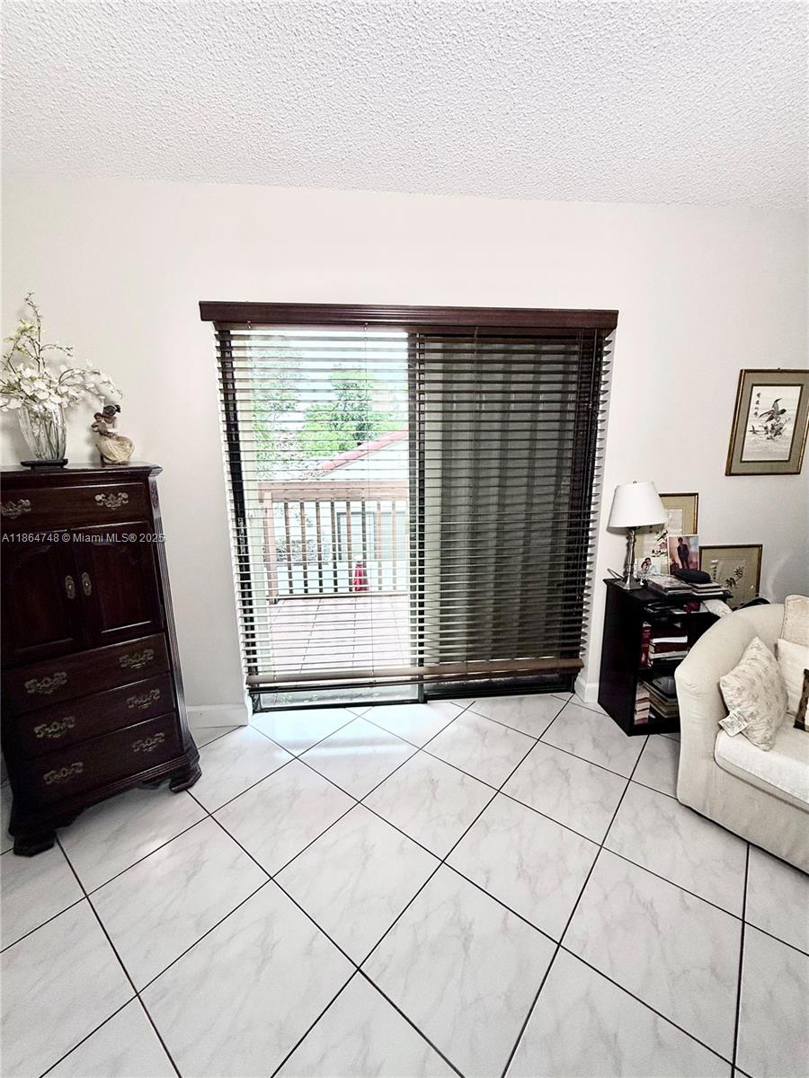 11028 Southwest 132nd Place, Unit 244 Miami, FL 33186 - Photo 22 of 25 a living room with furniture