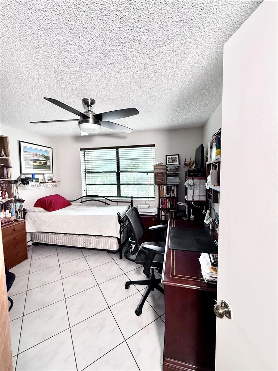 11028 Southwest 132nd Place, Unit 244 Miami, FL 33186 - Photo 24 of 25 a bedroom