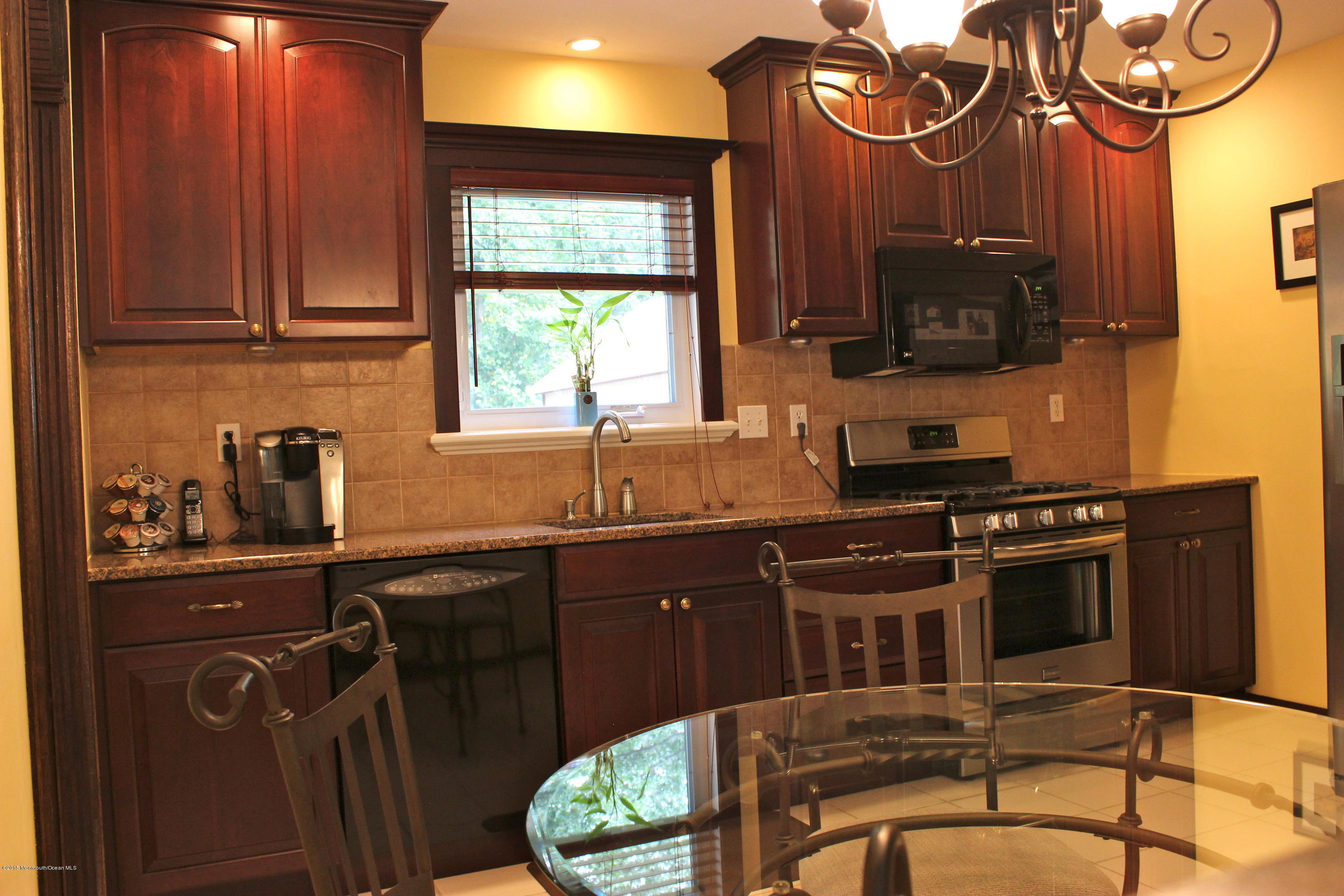 6 Buxton Road Jackson, NJ 08527 - Photo 3 of 41 a kitchen with stainless steel appliances a stove a sink and a microwave