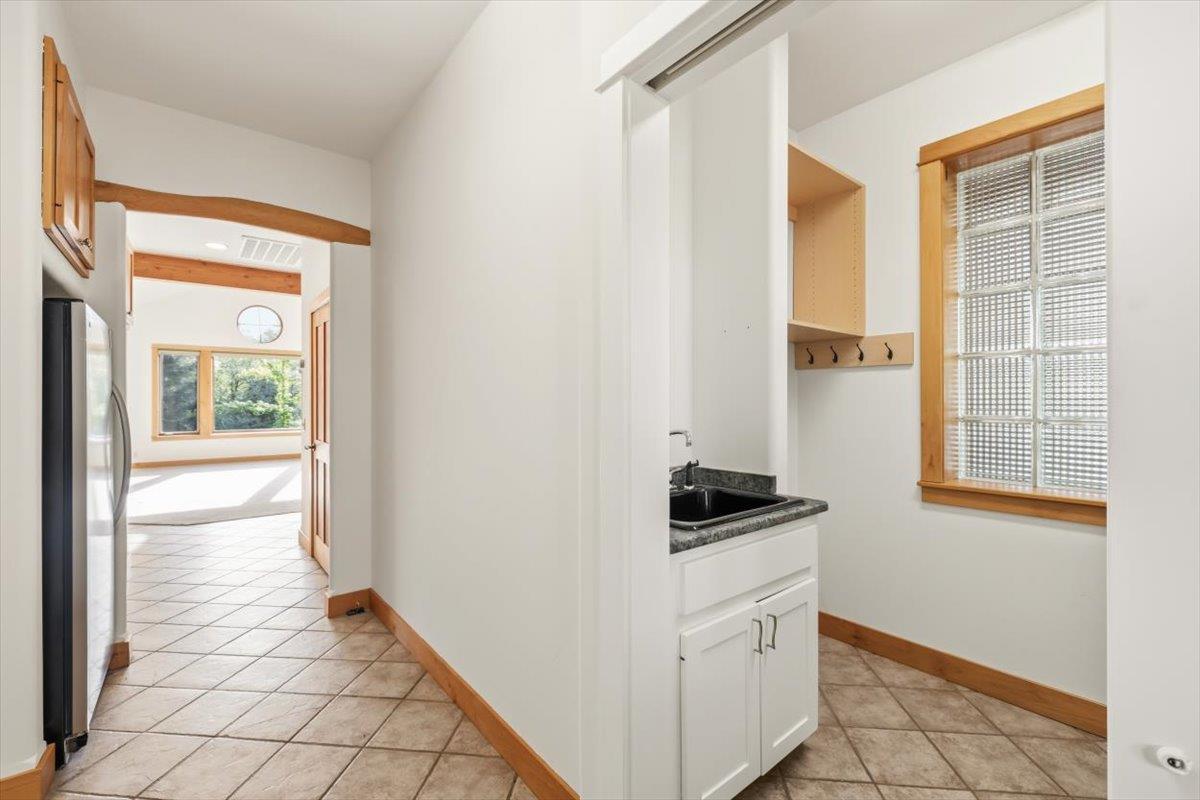 12531 Lowhills Road Nevada City, CA 95959 - Photo 26 of 92 a kitchen with white cabinets and a stove top oven