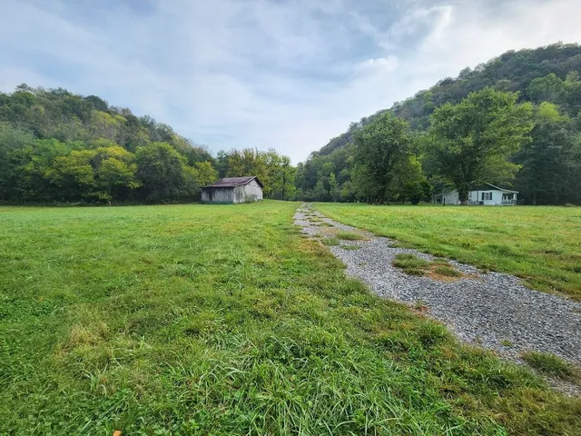 a view of a house with a yard porch and sitting area