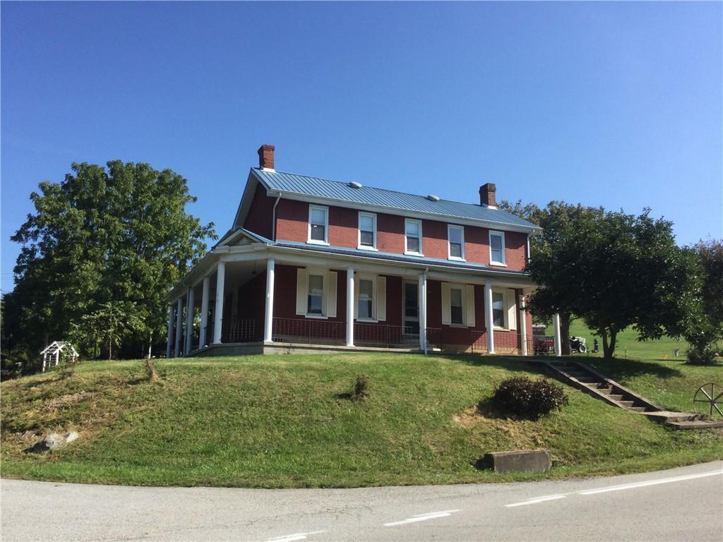 109 Woodies Road Waynesburg, PA 15370 - Photo 1 of 33 a front view of a house with a yard