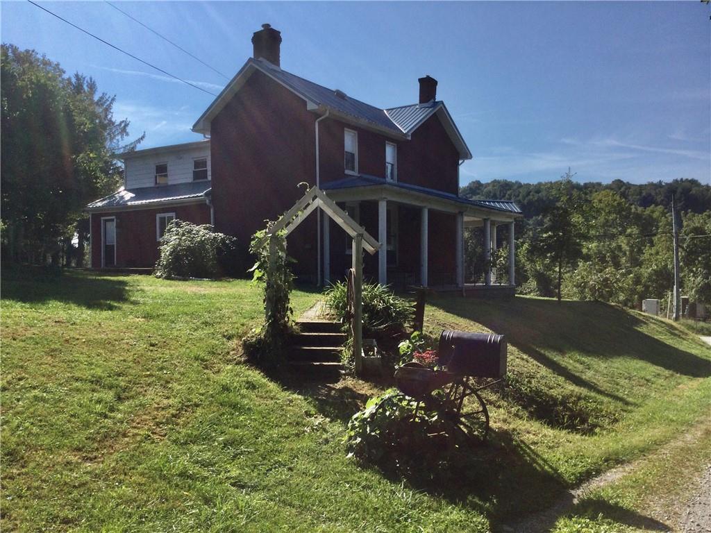 109 Woodies Road Waynesburg, PA 15370 - Photo 2 of 33 a front view of a house with a yard