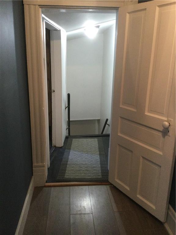 109 Woodies Road Waynesburg, PA 15370 - Photo 28 of 33 an empty room with wooden floor and entrance