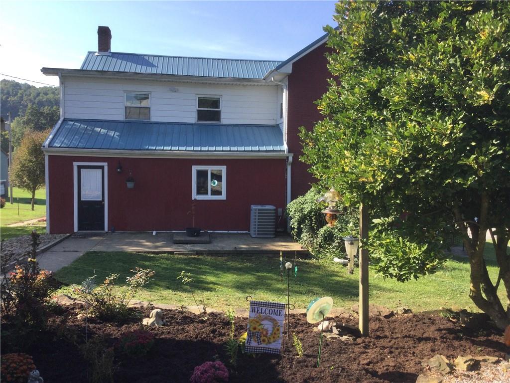 109 Woodies Road Waynesburg, PA 15370 - Photo 29 of 33 a house that has a tree in front of it