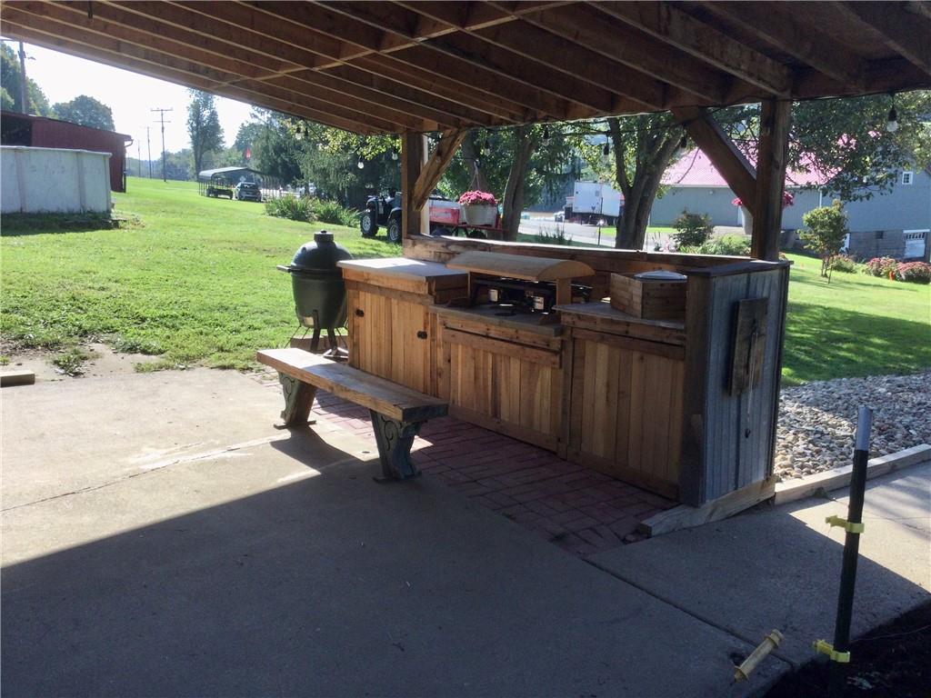 109 Woodies Road Waynesburg, PA 15370 - Photo 31 of 33 a view of a patio with wooden table and chairs