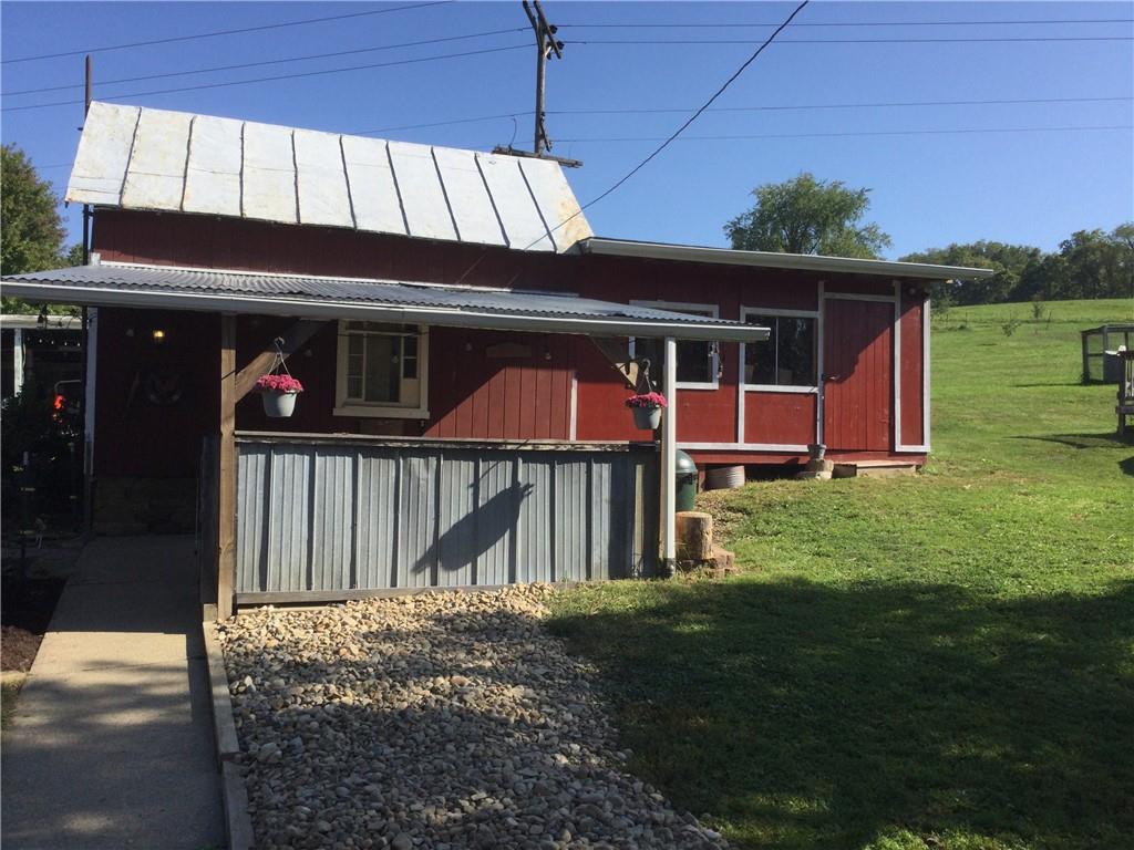 109 Woodies Road Waynesburg, PA 15370 - Photo 32 of 33 a view of a house with a porch and furniture