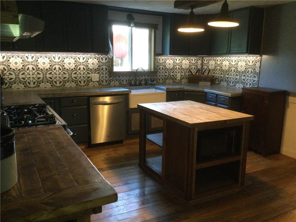 109 Woodies Road Waynesburg, PA 15370 - Photo 6 of 33 a kitchen with a sink and a stove top oven