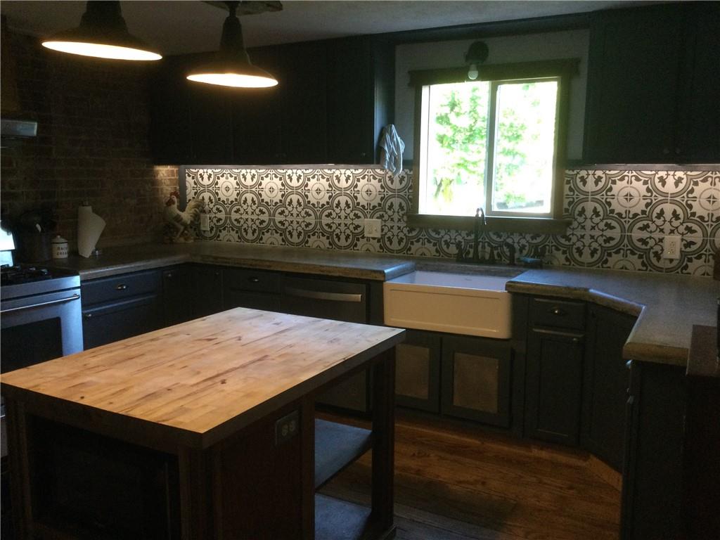 109 Woodies Road Waynesburg, PA 15370 - Photo 9 of 33 a kitchen with a sink a counter top space and appliances