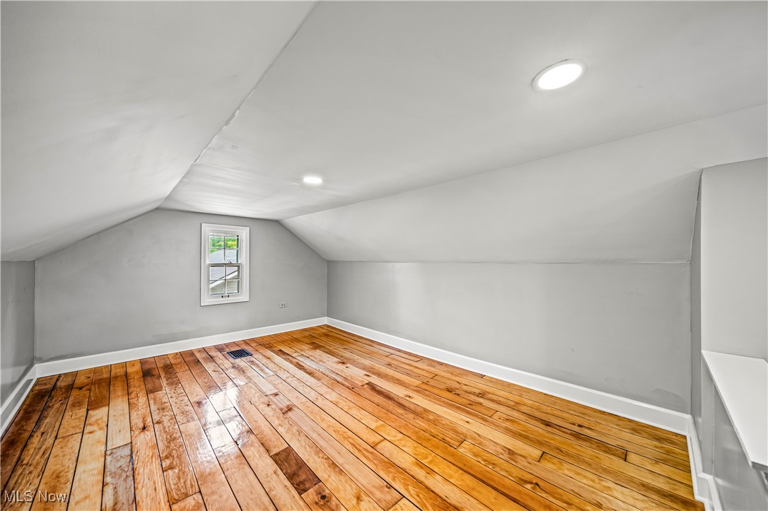 8219 Midland Road Mentor, OH 44060 - Photo 28 of 34 Additional living space featuring light wood-type flooring and lofted ceiling