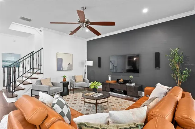 a living room with furniture and a flat screen tv