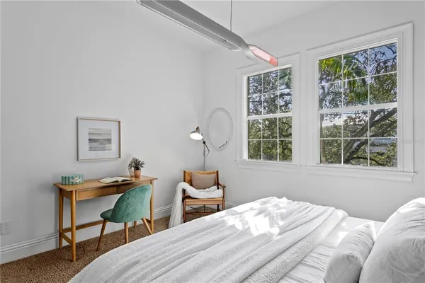 a bedroom with furniture and a couch