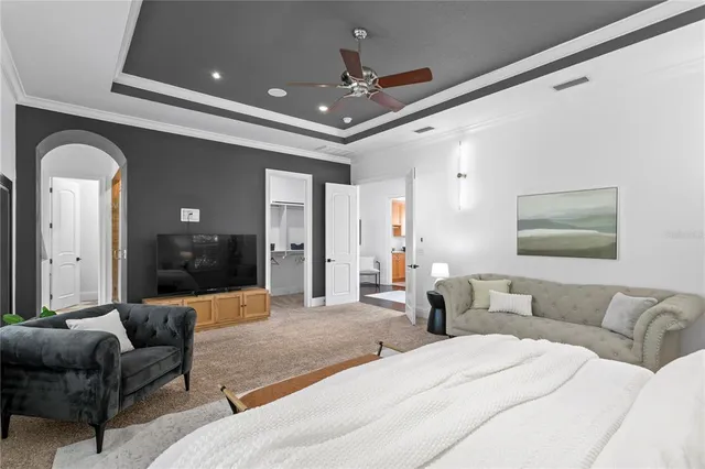 a bathroom with a tub a sink and a window