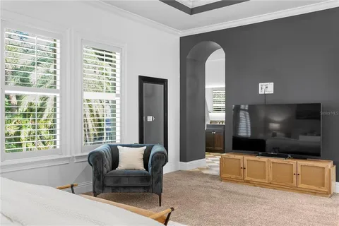 a bathroom with a granite countertop sink a toilet and shower