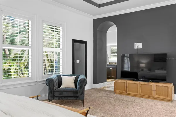 a bathroom with a granite countertop sink a toilet and shower