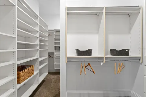 a bedroom with a bed with furniture and a window