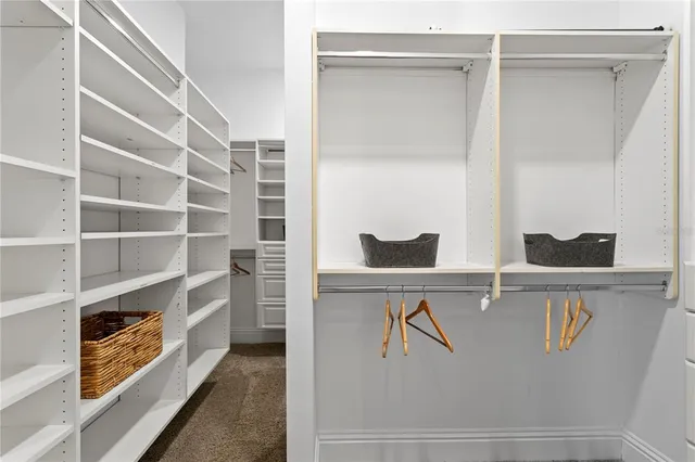 a bedroom with a bed with furniture and a window