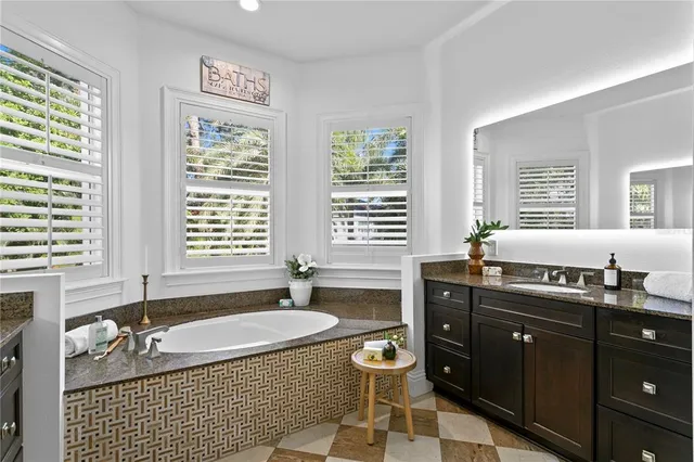 a bedroom with bed and a chandelier