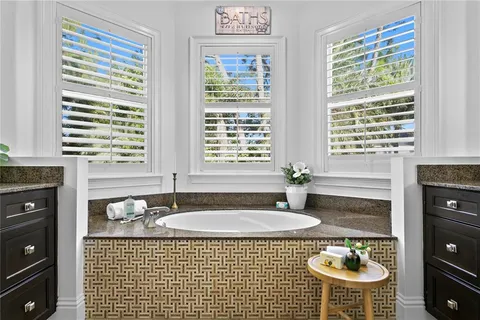 a bedroom with a bed and a table