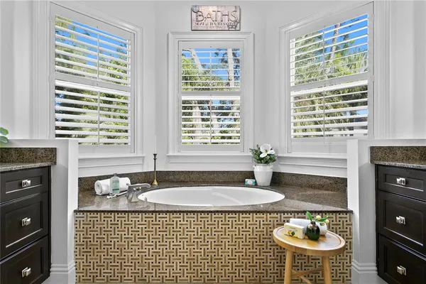 a bedroom with a bed and a table