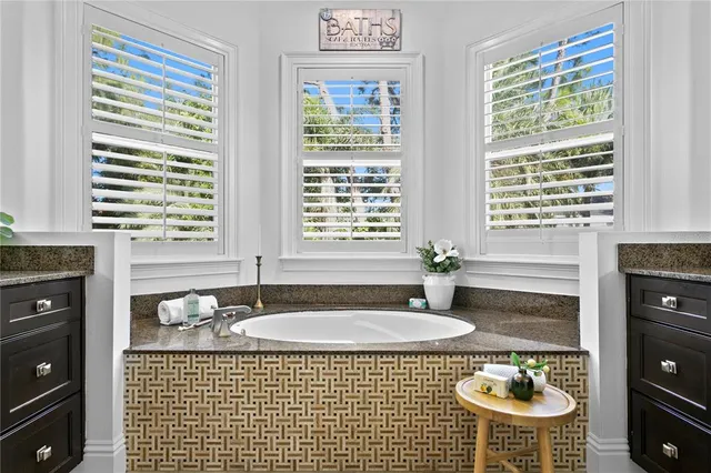 a bedroom with a bed and a table