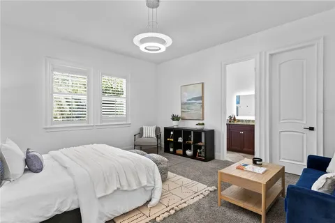 an aerial view of residential house with outdoor space and trees all around