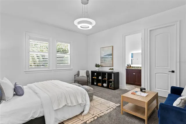 an aerial view of residential house with outdoor space and trees all around
