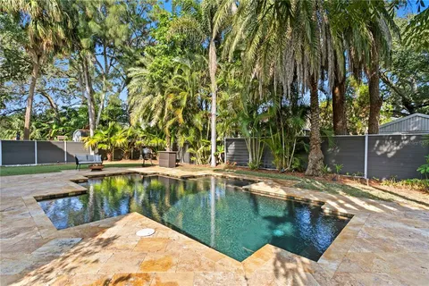 a view of a swimming pool with a patio