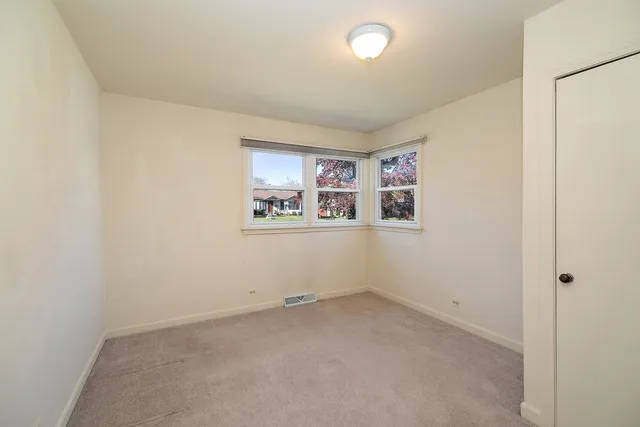 an empty room with shelves