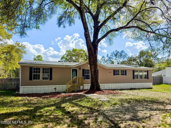 a house with trees in the background