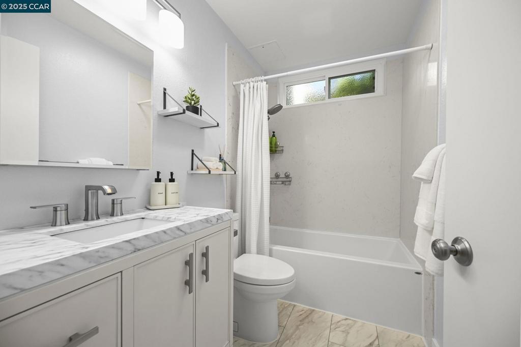 2560 Walnut Boulevard Walnut Creek, CA 94596 - Photo 12 of 29 a bathroom with a granite countertop sink toilet and shower