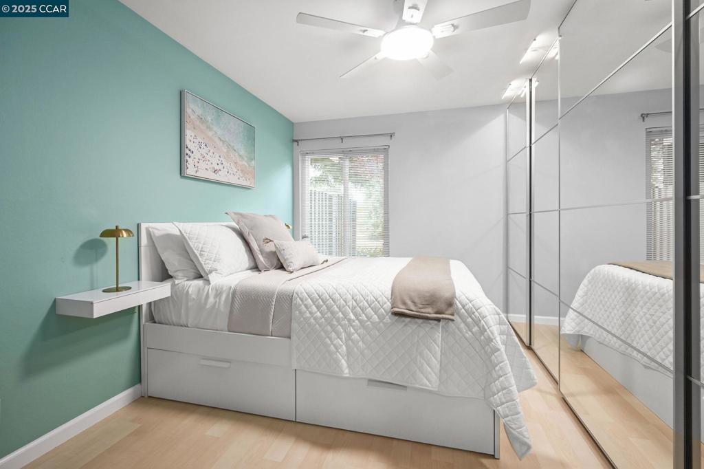 2560 Walnut Boulevard Walnut Creek, CA 94596 - Photo 14 of 29 a bedroom with a bed and a chandelier