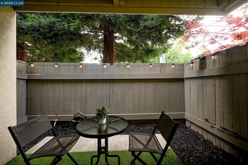 2560 Walnut Boulevard Walnut Creek, CA 94596 - Photo 16 of 29 a view of a chair and table in the back yard
