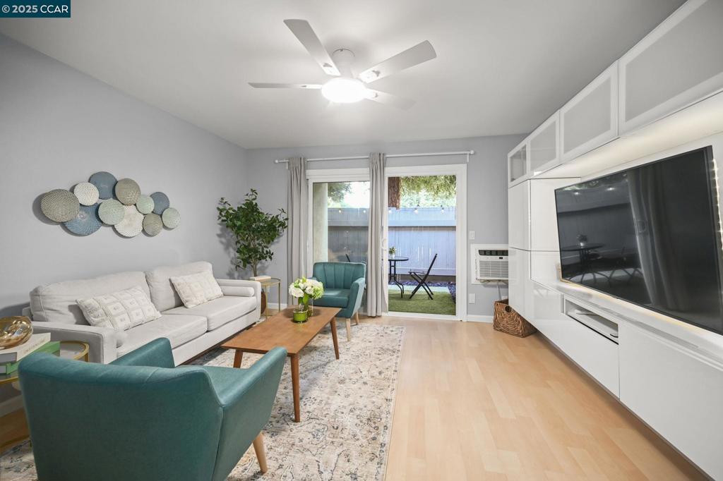 2560 Walnut Boulevard Walnut Creek, CA 94596 - Photo 2 of 29 a living room with furniture and a flat screen tv