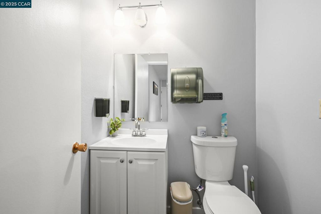 2560 Walnut Boulevard Walnut Creek, CA 94596 - Photo 24 of 29 a bathroom with a sink toilet and mirror