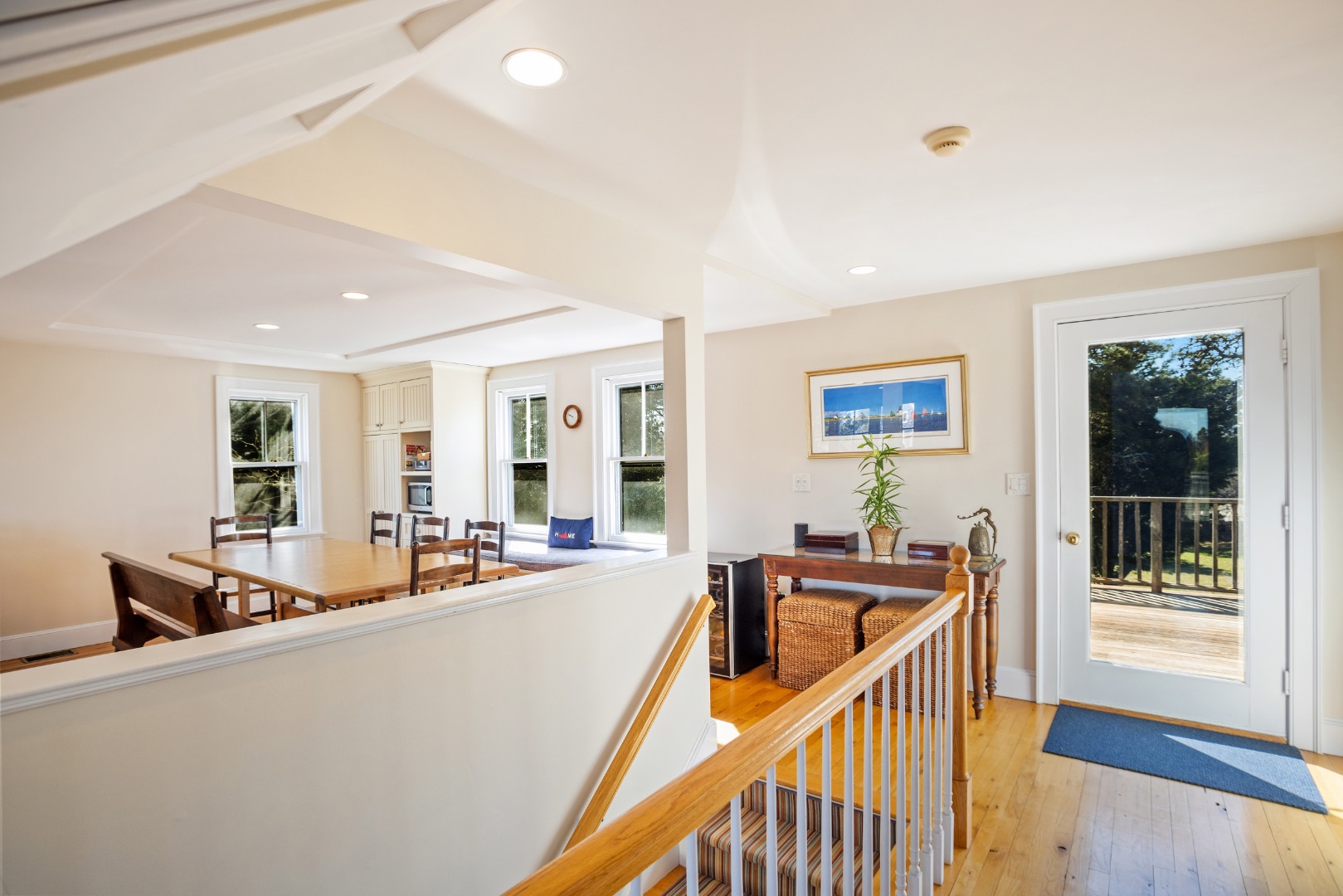 3 Chatham Road Nantucket, MA 02554 - Photo 12 of 37 a view of a living room a dining room with furniture and floor to ceiling windows