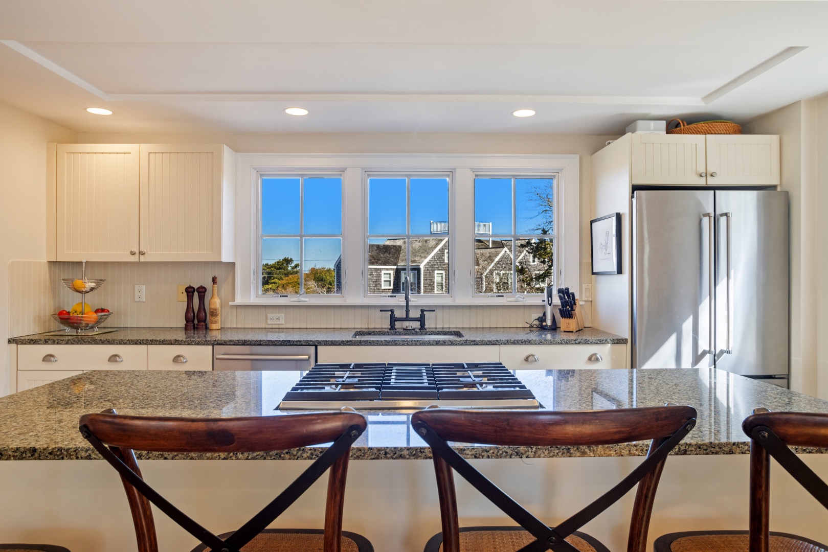3 Chatham Road Nantucket, MA 02554 - Photo 15 of 37 a kitchen with a table chairs refrigerator and microwave