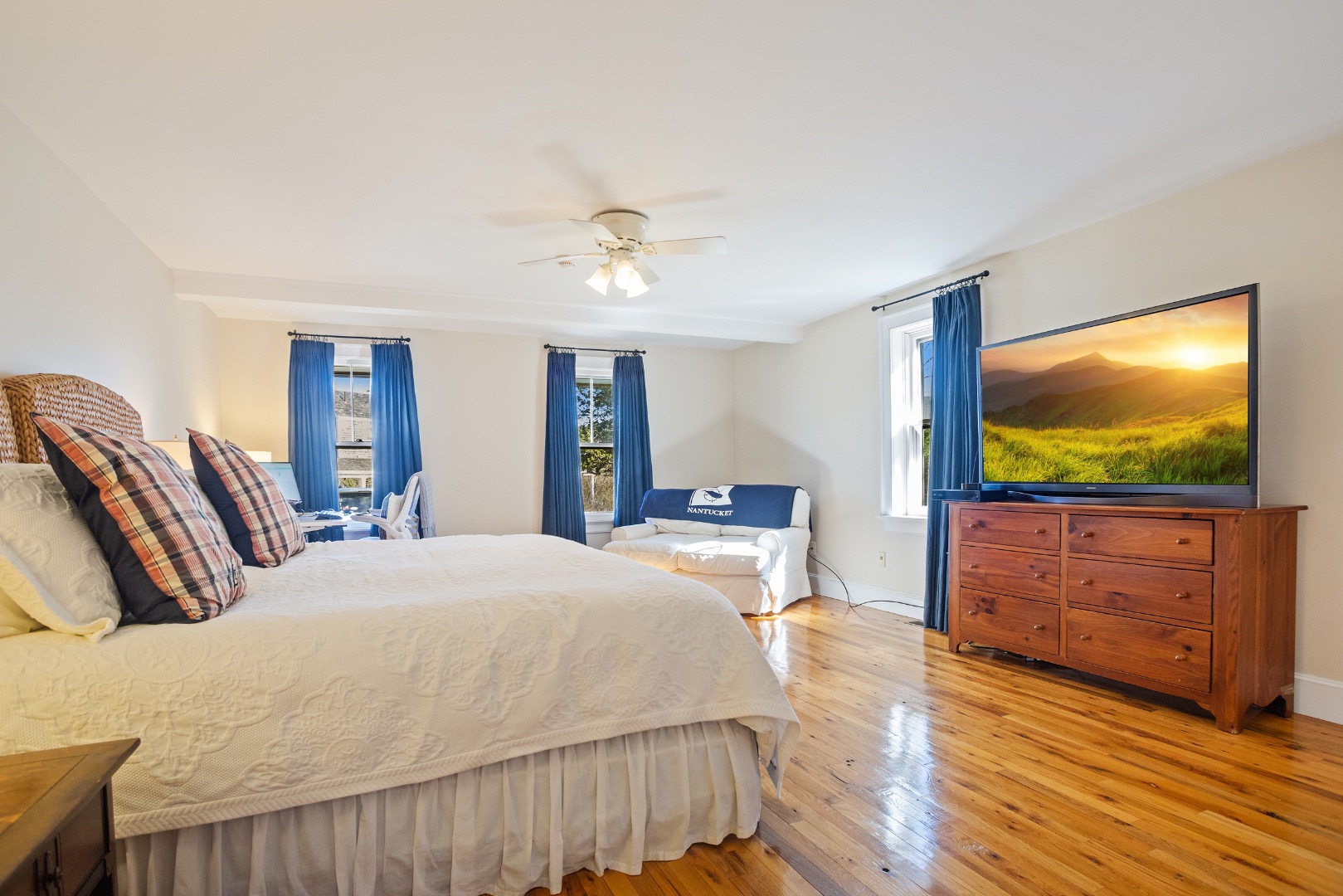 3 Chatham Road Nantucket, MA 02554 - Photo 24 of 37 a bedroom with a bed and a flat screen tv