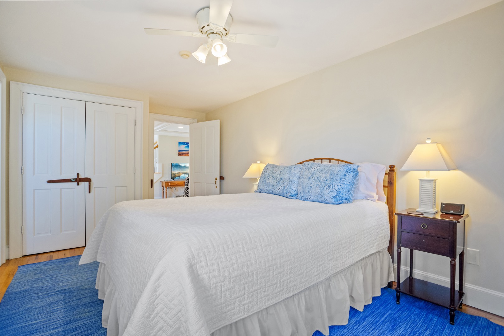 3 Chatham Road Nantucket, MA 02554 - Photo 25 of 37 a spacious bedroom with a bed and a wooden floor