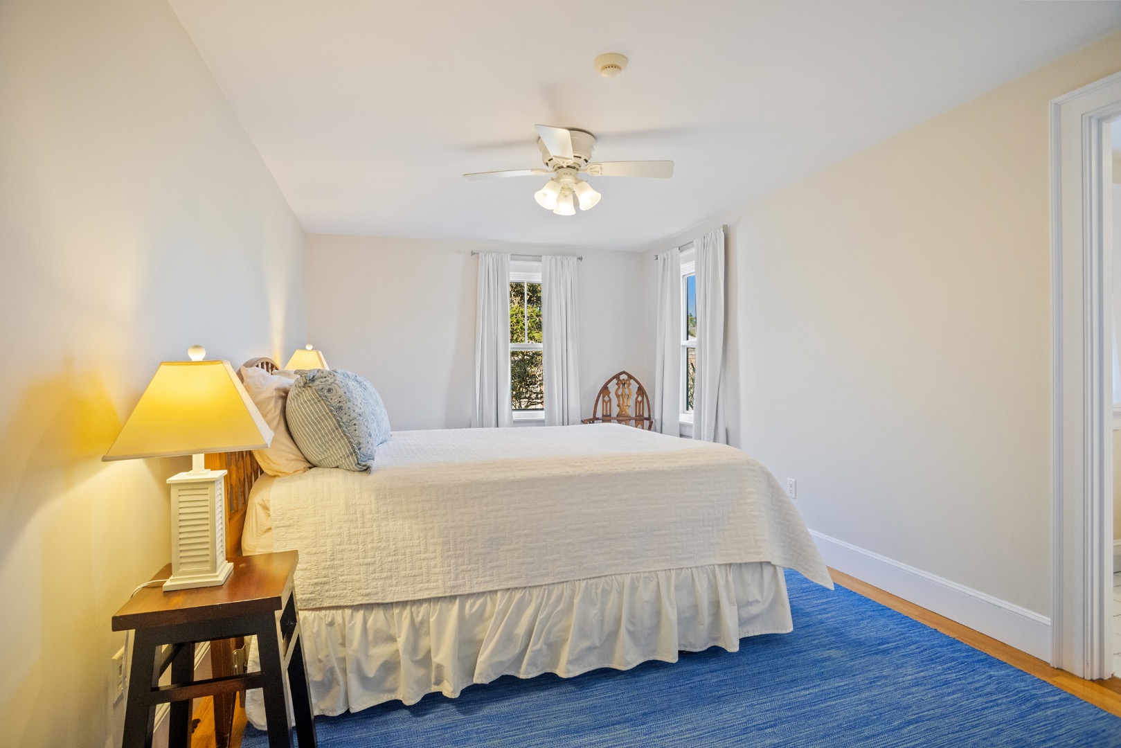 3 Chatham Road Nantucket, MA 02554 - Photo 27 of 37 a bedroom with a bed and a chandelier