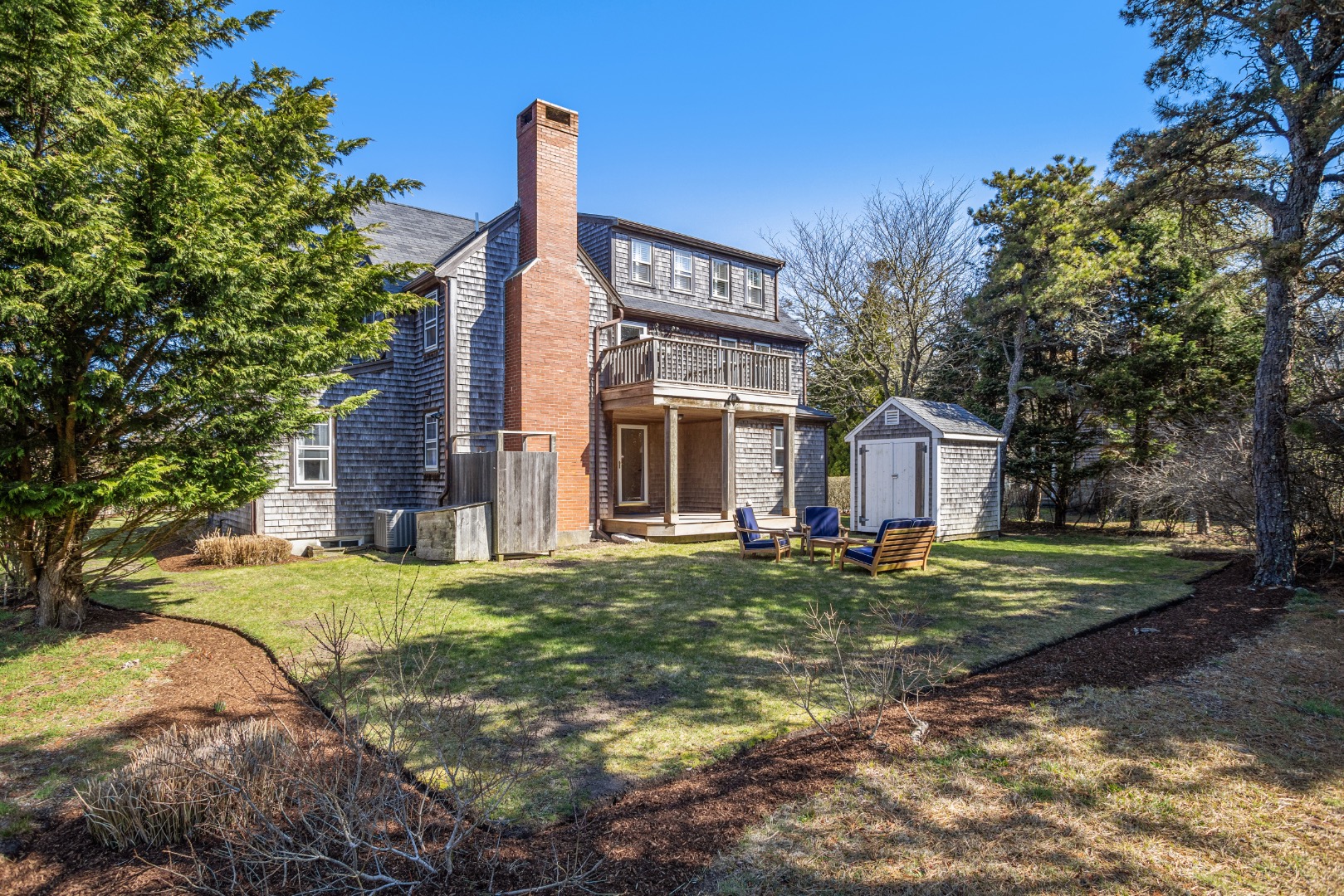 3 Chatham Road Nantucket, MA 02554 - Photo 32 of 37 a front view of a house with a garden