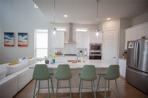 473 Chambers Place Fairview, TX 75069 - Photo 12 of 20 a dining room with furniture a large window and stainless steel appliances