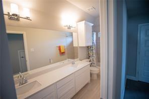 473 Chambers Place Fairview, TX 75069 - Photo 18 of 20 a en suite bathroom with a sink and a mirror