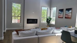 473 Chambers Place Fairview, TX 75069 - Photo 6 of 20 a living room with furniture and a flat screen tv